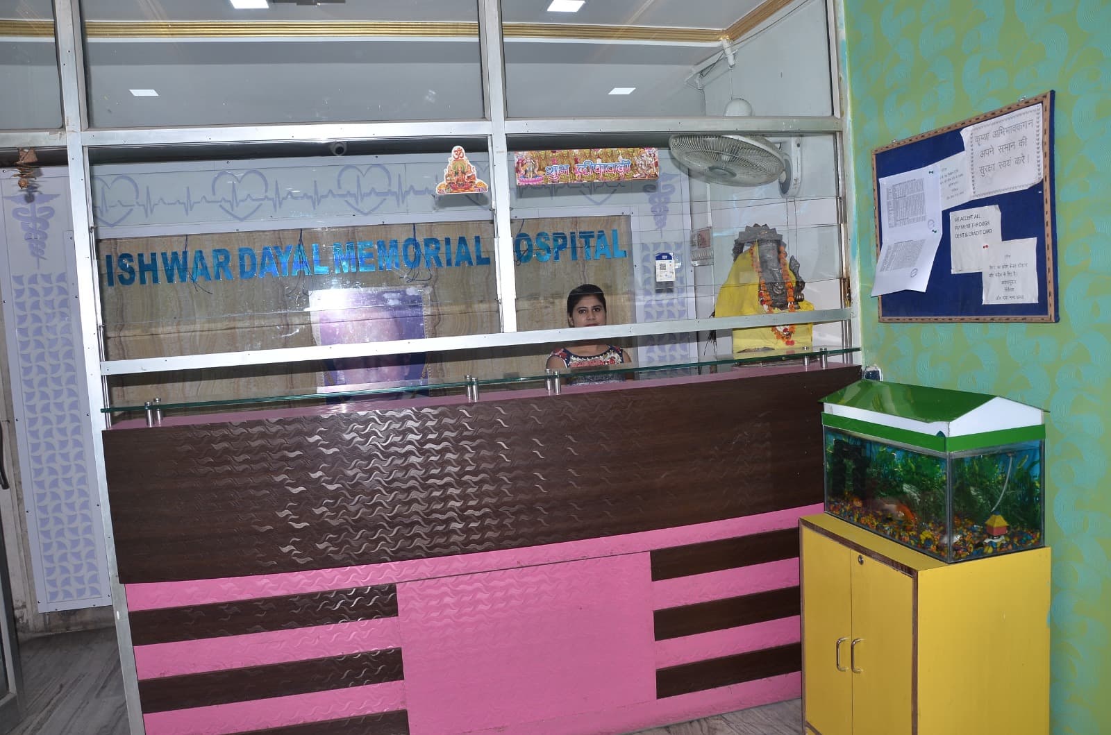 IDMH front reception desk with hospital logo on etched glass panel