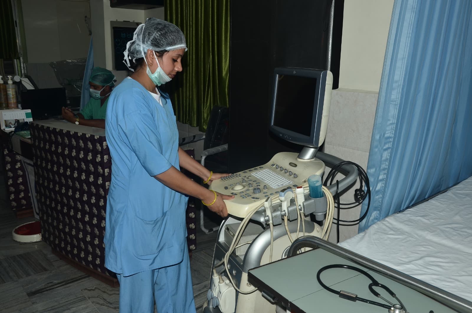 Ultrasound imaging room at IDMH with sonographer preparing a scan
